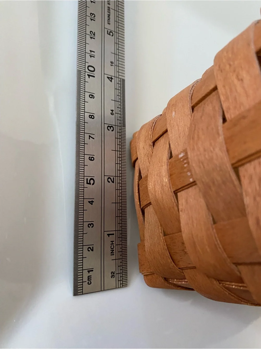 Vintage handwoven Longaberger Medium Key Basket with a leather handle.